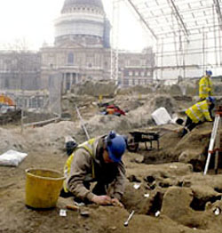 A photograph of an excavation in progress at Paternoster Square with St Paul's Cathedral in the background. Follow this link to the Archaeology Service website